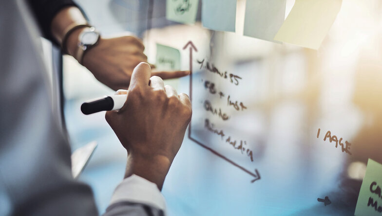 Man painting matrix on a whiteboard